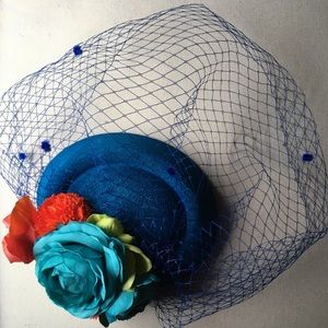 Altered blue flower fascinator hat
